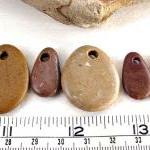 Drilled pebbles. Rocks from..