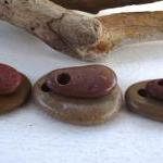 Drilled pebbles. Rocks from..