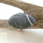 Stone pebble ring. Beach pe..