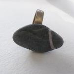 Stone pebble ring. Beach pe..